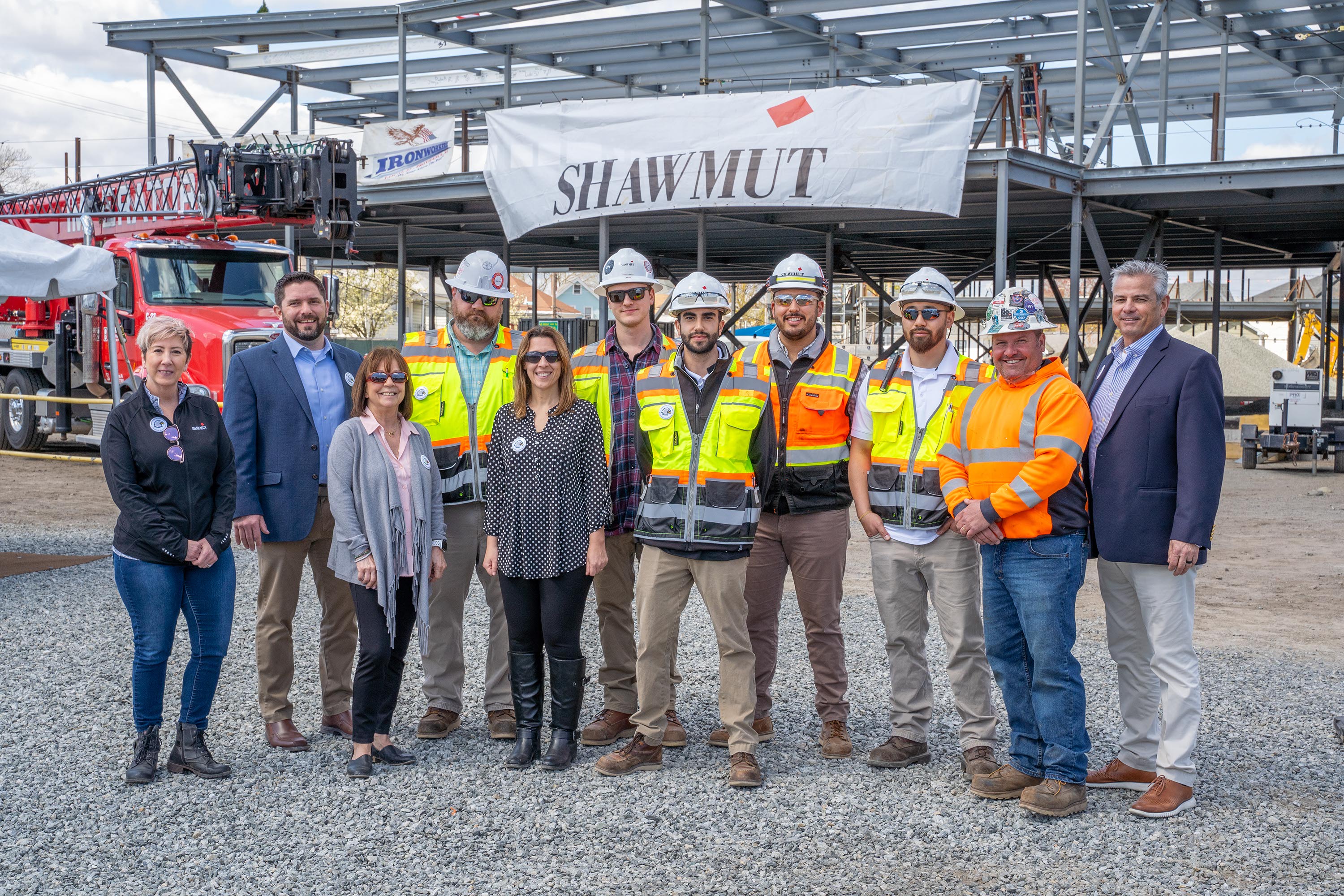 Shawmut Design and Construction, Pawtucket School Department, and Colliers Project Leaders celebrate topping off on Baldwin Elementary School